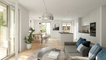 Open-concept living room and dining area, hardwood floors, large windows, modern furniture including a gray sofa, glass coffee table, and pendant lighting, kitchen with white cabinets and a dishwasher visible