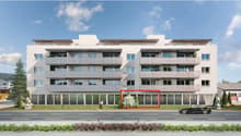 Modern apartment building, 4 floors, balconies, large windows, green lawn, trees, car driving