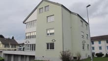 4-story residential building, balcony on the first floor, garage in the ground floor