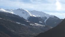 Snowy mountains under a blue sky