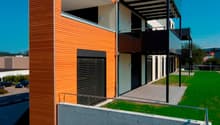 modern 2-story house, wooden wall, concrete wall, large balcony, entrance area, glass doors