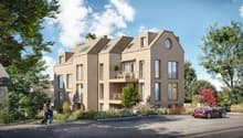 3 story house, beige exterior, multiple windows, balconies, circular window on the front