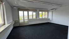 empty room, white walls, black carpet, large windows, air conditioning unit