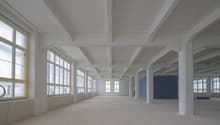 empty room, high ceiling, windows, white walls, pillars