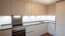 modern kitchen, silver AEG appliances, stainless steel sink, ceramic tiles, tiled backsplash