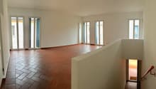 tiled floor, white walls, large windows, balcony