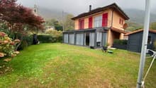 modern detached house, red shutters, brown roof, chimney, glass extension, garden, satellite dish