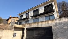 2 story house, garage, balcony with railing