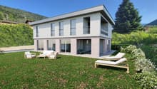 two-story house, glass windows, balcony on second floor, lawn, outdoor chairs, green lawn, large garden, trees