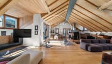wooden ceiling, wooden floor, sofa, television, view of the mountains