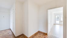 empty room, white walls, wooden floor, white doors, glass door
