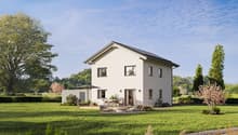 Two story house, solar panels, white walls, gray roof, glass door, outdoor seating area, fireplace, fire pit, umbrella, garden, grassy lawn