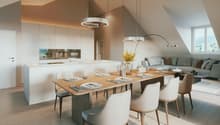 Dining room with a large wooden table, white chairs, a kitchen with modern appliances, and a living area with a couch and a window.