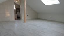 empty room, white tiles, wooden floor, skylight, toilet, small window