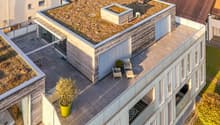 top view, modern architecture, multiple floors, large windows, green rooftop