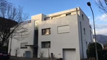 modern white house, flat roof, 2 garages, glass windows, large entrance