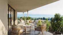 Balcony with outdoor furniture, glass railing, plants, table, view of mountains