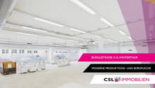 spacious industrial property with white walls, white ceilings, white floors, white industrial machines, bright lighting