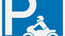 Blue square sign with a white motorcycle icon and the letter 'P' indicating a designated parking area for motorcycles.