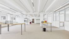 empty room, metal tables, trash bin, lamps, glass windows, white walls