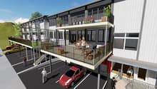 3 story building, white exterior, multiple balconies, parking lot, stairs, cars parked