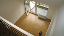 wooden floor, open sliding glass doors, radiator, balcony