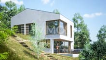 Maison moderne avec grandes baies vitrées pour profiter de la vue