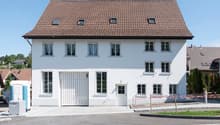 2 story house, white paint, brown roof, garage, large windows