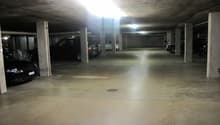 empty multistory underground parking lot with multiple pillars, no visible signs of damage