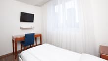 bed, desk, chair, TV, outlet