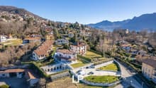 Large villa with multiple buildings, large garden, swimming pool, mountain view