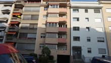 Multi-story apartment building, balconies, underground parking, entrance
