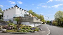 modern white house, raised ground floor, balcony, garden, parking place