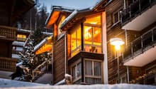 Wooden chalet style, multi-storey, balconies, illuminated windows, street lighting