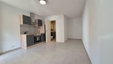 Empty kitchen, white tiles, wooden cabinets, built-in oven, countertop, sink, white walls