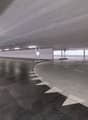 Underground parking lot with designated parking spaces and lane markings.