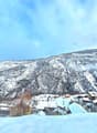 Snowy mountains, several houses, village