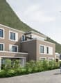 2 story house, brown walls, white windows, 3 balconies, cars, mountains