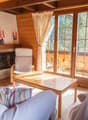living room, fireplace, glass doors, couch, table, lamp, TV