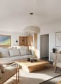 modern living room with white sofa, wooden coffee table, carpet, wooden chairs, lamp, frame, plants, view of hills