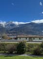 Mountain view, house, road, greenery, mountains in the background