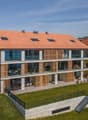 modern house, red roof, large windows, multiple balconies, raised ground floor, garden, stairs