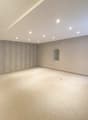 empty room, neutral color walls, carpeted floor, recessed ceiling lights, small window