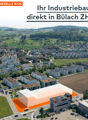Industrial building, large plot, multiple buildings in the background, parking lot, road