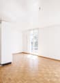 empty kitchen, white walls, wooden floor, open door, balcony