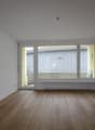empty room, wooden floor, white walls, double glass doors to balcony, glass windows