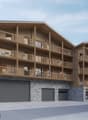 Modern wooden building with multiple floors, balconies, and garages