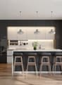 modern kitchen, black cabinets, white countertops, four bar stools, under-mount sink, oven, flower vase, plant