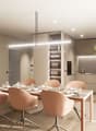 large dining table with chairs, light fixtures, shelves with wine glasses, modern design, large windows