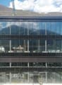 modern office building, glass facade, multiple floors, construction site